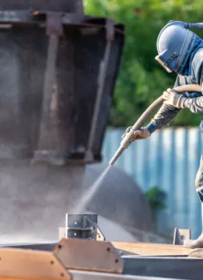 Afbladderende en zandstralen